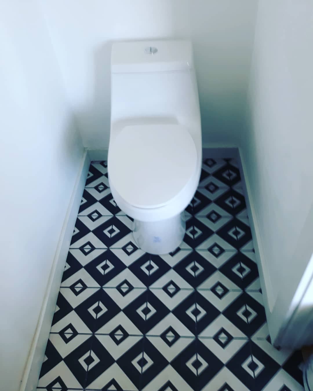 Remodeled bathroom tile and toilet